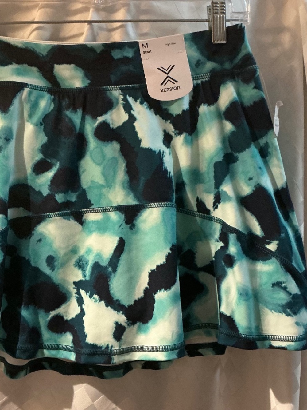 Xersion brand skort, size medium, NWT - greens, teal, black